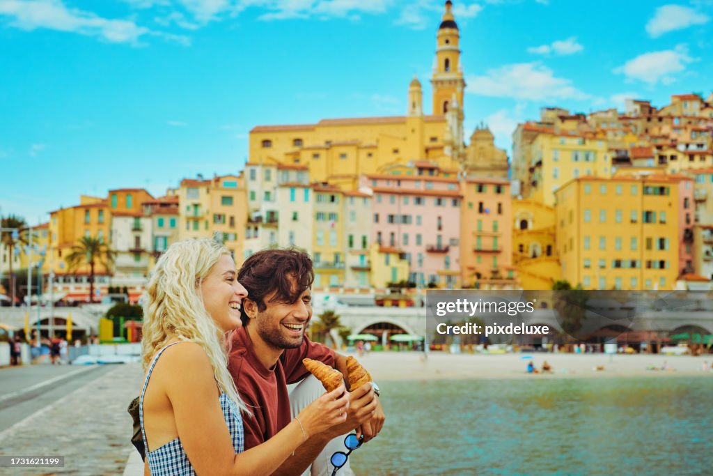 Young millennial couple enjoying their trip to Menton, while travelling in the south of France.