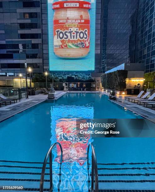 Lights are reflected on the swimming pool at the J.W. Marriott Hotel, located near the L.A. Live Complex off Olympic Blvd, is viewed on September 18...