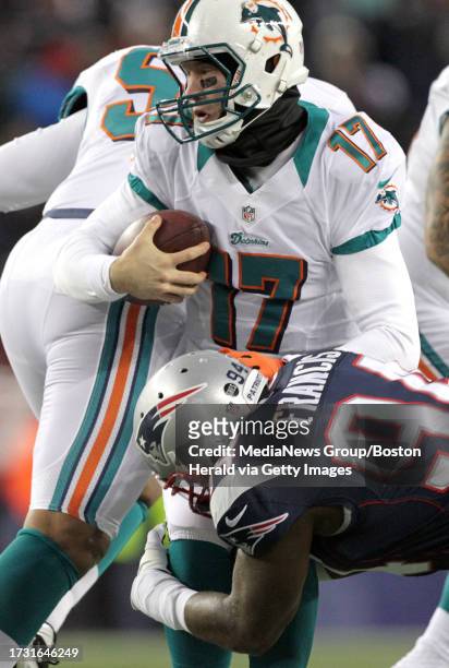 New England Patriots defensive end Justin Francis sacks Miami Dolphins quarterback Ryan Tannehill in the 1st quarter.First quarter action the New...
