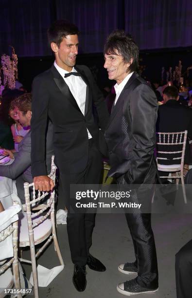 Novak Djokovic and Ronnie Wood attend the Novak Djokovic Foundation inaugural London gala dinner at The Roundhouse on July 8, 2013 in London,...