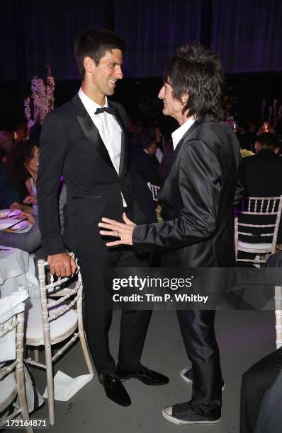 Novak Djokovic and Ronnie Wood attend the Novak Djokovic Foundation inaugural London gala dinner at The Roundhouse on July 8, 2013 in London,...