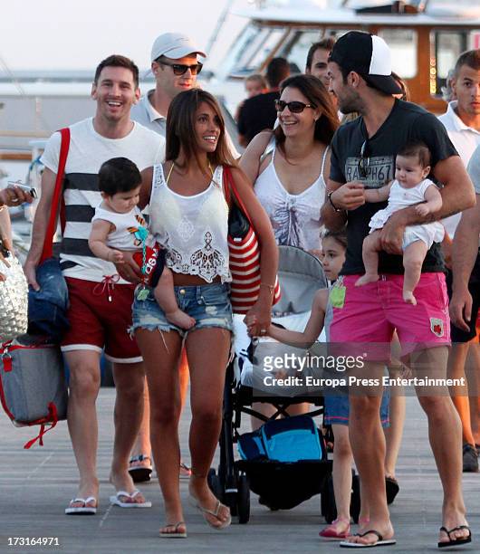 Cesc Fabregas , his daughter Lia Fabregas, Leo Messi , his girlfriend Antonella Rocuzzo and their son Thiago Messi are seen on July 8, 2013 in Ibiza,...
