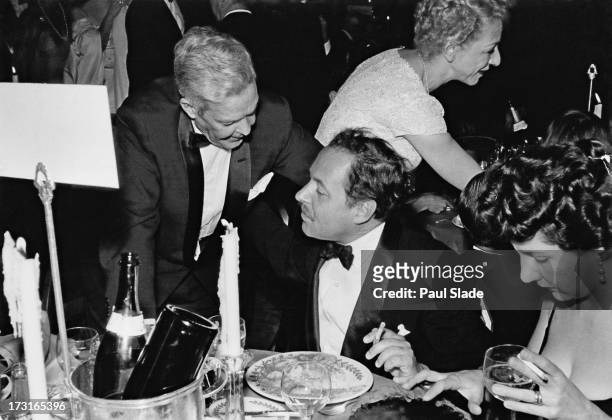 American playwright Tennessee Williams dining at the Waldorf-Astoria after the premiere of 'Baby Doll', New York City, 18th December 1956. The film...