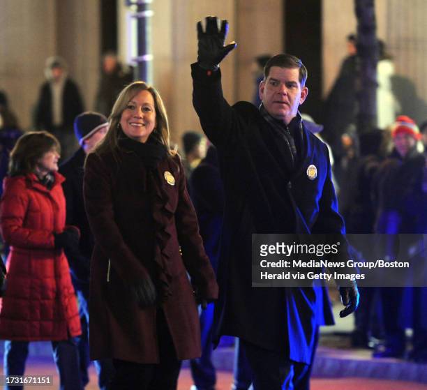 Boston Mayor Martin J. Walsh and his girlfriend Lorrie Higgins walk in a First Night parade in Boston on Wednesday, December 31, 2014. Staff photo by...