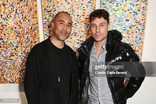 Robi Walters and Joey Essex attend the private view of 'A Nation Of Millions' by Robi Walters at Quantus Gallery on October 19, 2023 in London,...