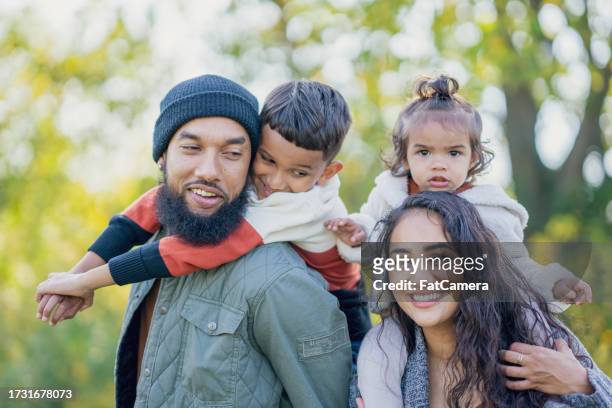 fall family portrait - arab couple stock pictures, royalty-free photos & images