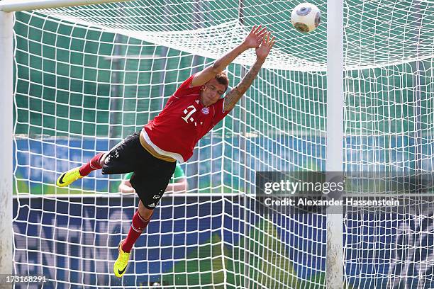 Mario Mandzukic of FC Bayern Muenchen jokes as a goal keeper after a training session at Campo Sportivo on July 9, 2013 in Arco, Italy.