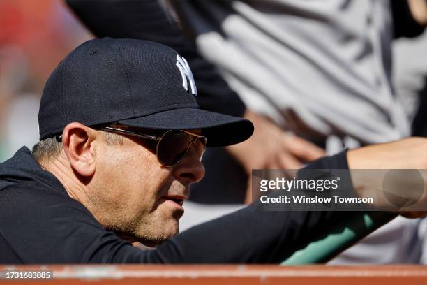 Manager Aaron Boone of the New York Yankees looks on from the dugout during the first inning of game one of a doubleheader against the Boston Red Sox...