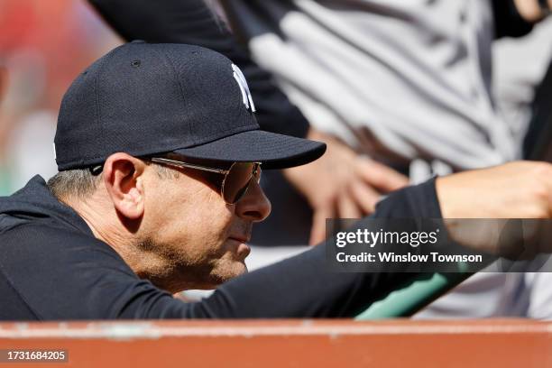 Manager Aaron Boone of the New York Yankees looks on from the dugout during the first inning of game one of a doubleheader against the Boston Red Sox...