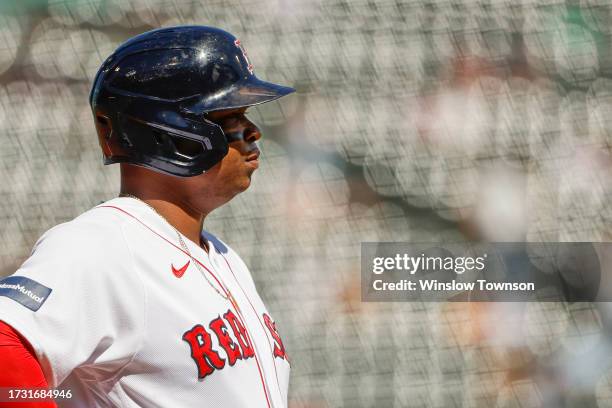 Rafael Devers of the Boston Red Sox looks on during the first inning of game one of a doubleheader against the New York Yankees at Fenway Park on...