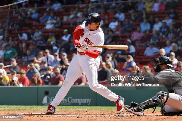 Triston Casas of the Boston Red Sox swings at a pitch against the New York Yankees during the first inning of game one of a doubleheader at Fenway...