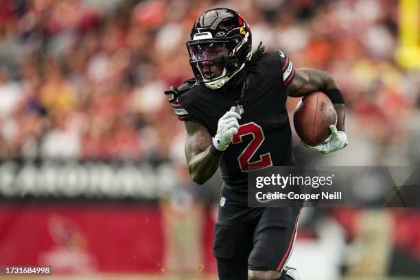 Marquise Brown of the Arizona Cardinals runs the ball during an NFL game against the Cincinnati Bengals at State Farm Stadium on October 8, 2023 in...