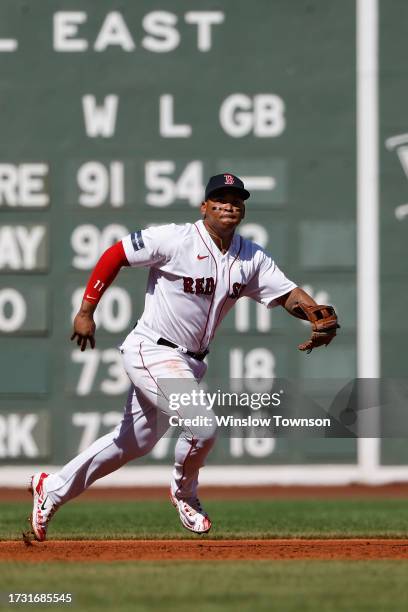 Rafael Devers of the Boston Red Sox fields a groundball against the New York Yankees during the first inning of game one of a doubleheader at Fenway...