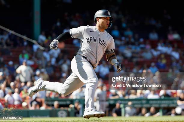 Gleyber Torres of the New York Yankees watches a home run against the Boston Red Sox during the sixth inning of game one of a doubleheader at Fenway...