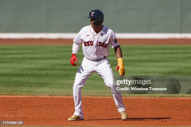 Ceddanne Rafaela of the Boston Red Sox leads off base against the New York Yankees during the first inning of game one of a doubleheader at Fenway...
