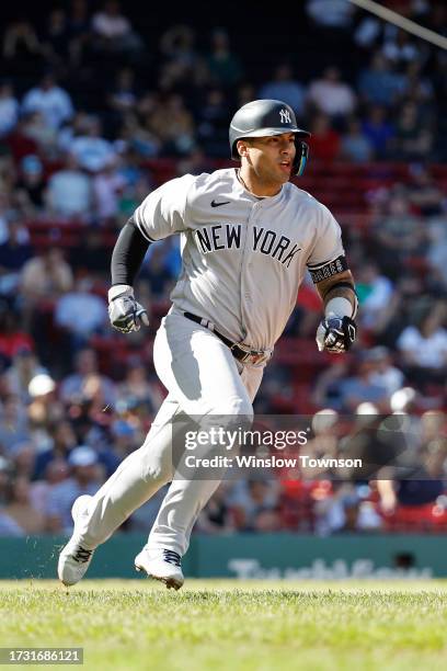 Gleyber Torres of the New York Yankees watches a home run against the Boston Red Sox during the sixth inning of game one of a doubleheader at Fenway...