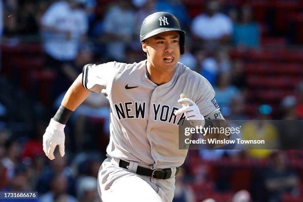 Anthony Volpe of the New York Yankees runs out a hit against the Boston Red Sox during the sixth inning of game one of a doubleheader at Fenway Park...