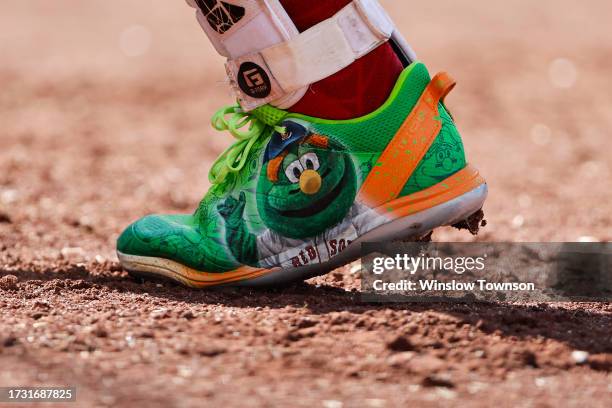 Close-up view of the Adidas Wally the Green Monster cleats of Justin Turner of the Boston Red Sox are seen during the sixth inning of game one of a...