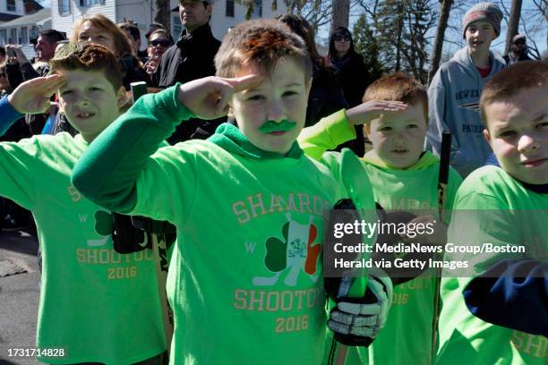 Boston,MA. Area children children salute the flag during the National Anthem, shortly before they competed at the annual Shamrock Shootout Street...