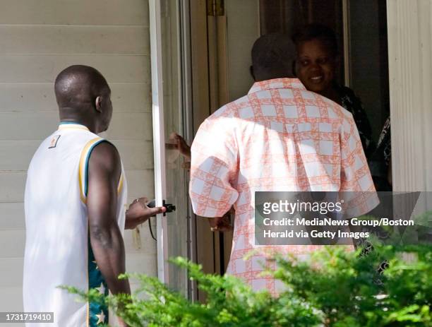 Relatives and friends enter the house in Brockton, MA where yesterday two 4 year old twins drowned in a backyard pool. Photographed on Sunday, August...