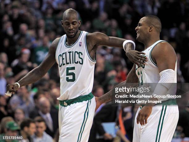 Boston Celtics power forward Kevin Garnett and power forward Glen Davis celebrate after sealing the deal for their win in the fourth quarter of an...