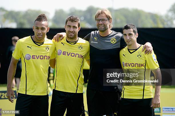 Head coach Juergen Klopp poses with new players Pierre-Emerick Aubameyang , Sokratis and Henrikh Mkhitaryan during the Borussia Dortmund Team...