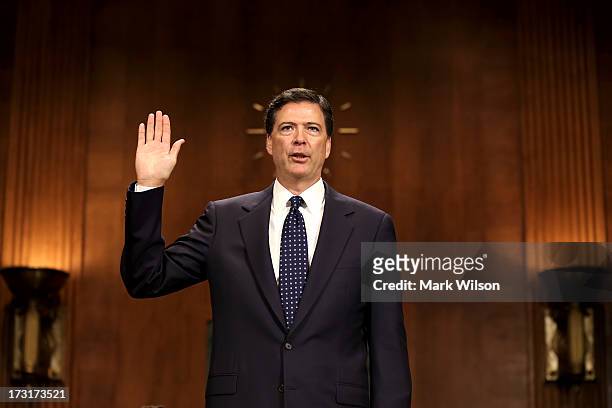 James Comey Jr., nominee to be director of the Federal Bureau of Investigation is sworn in for his Senate Judiciary Committee confirmation hearing on...