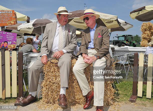 Two gentlemen take a break and chat as they sit on a couple of hay bales at the Great Yorkshire Show on July 9, 2013 in Harrogate, England. The Great...