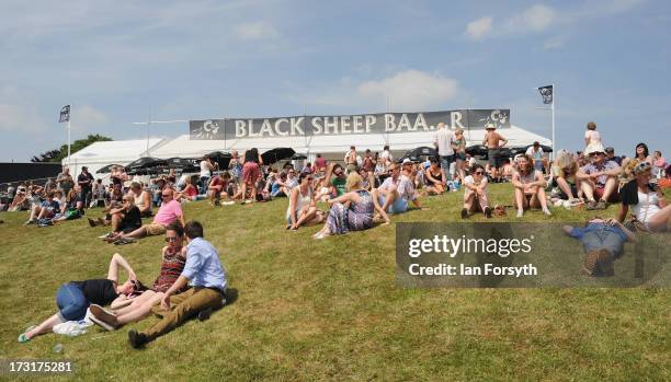 Crowds of visitors sit outside the 'Black Sheep Brewery' beer tent at the Great Yorkshire Show on July 9, 2013 in Harrogate, England. The Great...