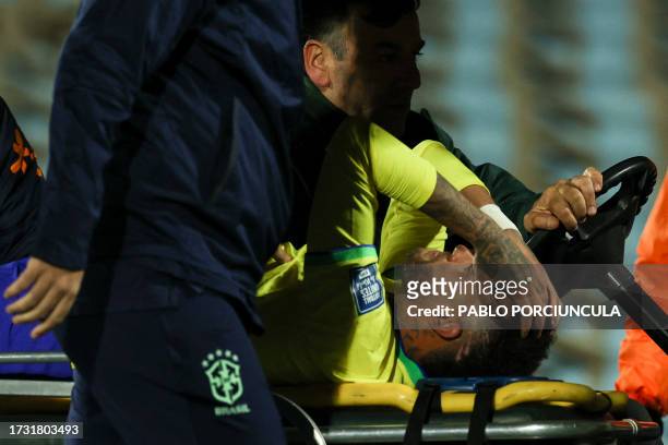 Brazil's forward Neymar leaves the field crying in pain after an injury during the 2026 FIFA World Cup South American qualification football match...
