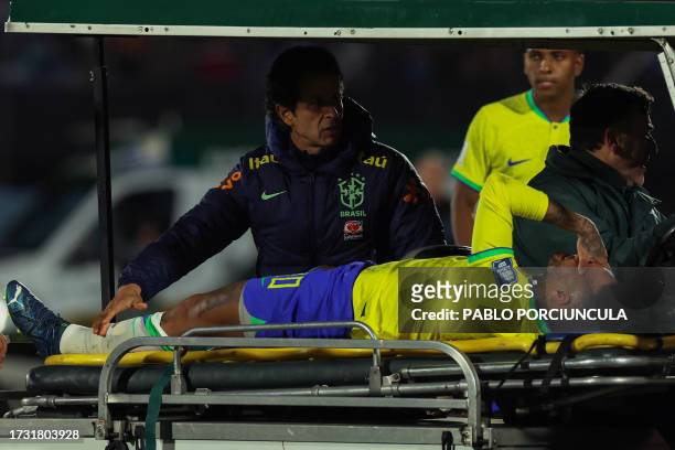 Brazil's forward Neymar leaves the field crying in pain after an injury during the 2026 FIFA World Cup South American qualification football match...