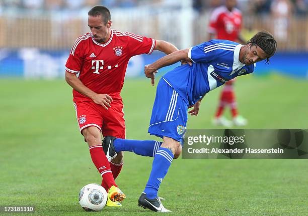 Franck Ribery of Bayern Muenchen battles for the ball with Massimo Paci of Brescia during the friendly match between Brescia Calcio and FC Bayern...