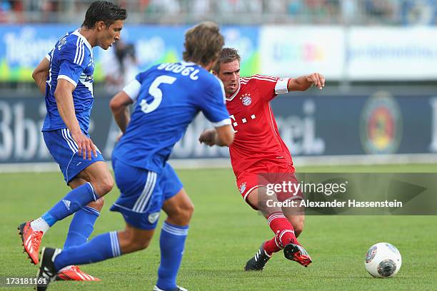 Philipp Lahm of Bayern Muenchen battles for the ball with Alessandro Budel during the friendly match between Brescia Calcio and FC Bayern Muenchen at...