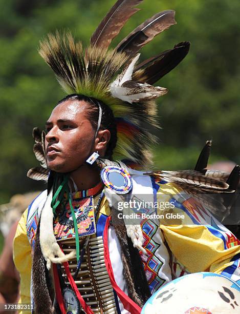 Dancer takes part in the intertribal dance as part of the 92nd Mashpee Wampanoag Powwow at the Barnstable County Fairgrounds in East Falmouth, July...