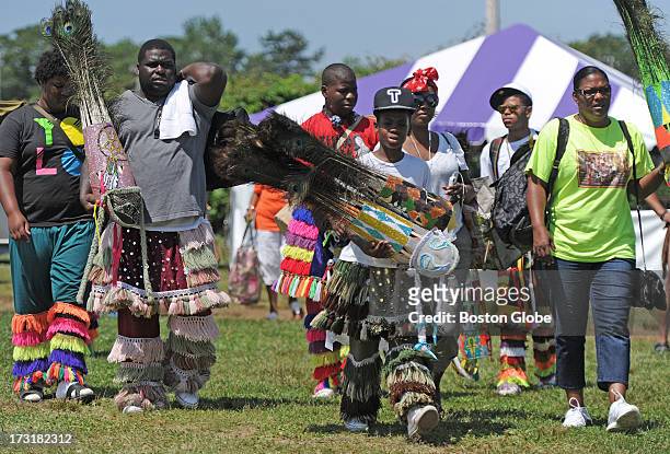 Members of the Warwick Combey Troupe of Bermuda arrive at the 92nd Mashpee Wampanoag Powwow at the Barnstable County Fairgrounds in East Falmouth,...