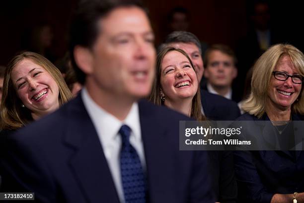 James Comey, nominee for FBI Director, shares a laugh during his conformation hearing before the a Senate Judiciary Committee in Dirksen Building as...
