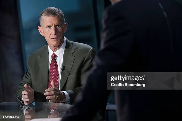 General Stanley McChrystal, chairman of Siemens Government Technologies Inc., talks prior to a Bloomberg Television interview in Washington, D.C.,...