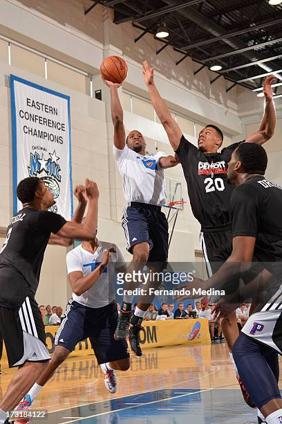 Michael Snaer of the Oklahoma City Thunder shoots against Ryan Evans of the Detroit Pistons during the 2013 Southwest Airlines Orlando Pro Summer...