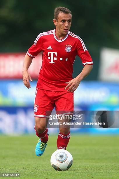 Rafinha of Bayern Muenchen runs with ball during the friendly match between Brescia Calcio and FC Bayern Muenchen at Campo Sportivo on July 9, 2013...