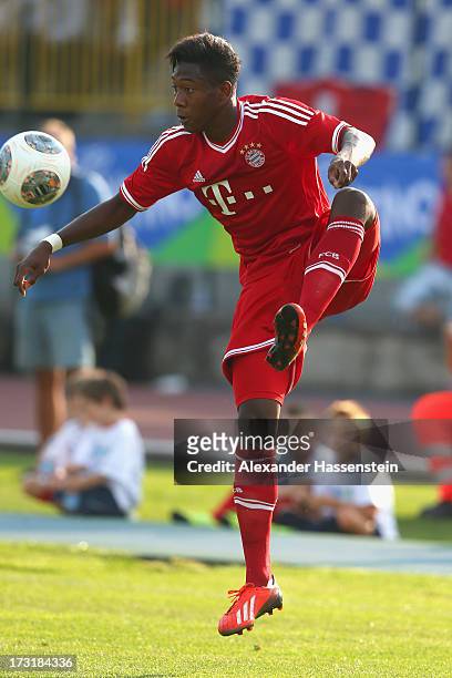 David Alaba of Bayern Muenchen runs with ball during the friendly match between Brescia Calcio and FC Bayern Muenchen at Campo Sportivo on July 9,...