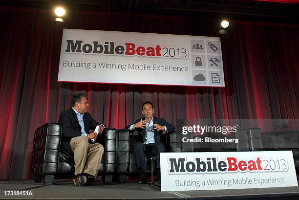 Young Sohn, president and chief strategy officer of Samsung Corp., right, speaks as moderator John China listens during the MobileBeat Conference in...