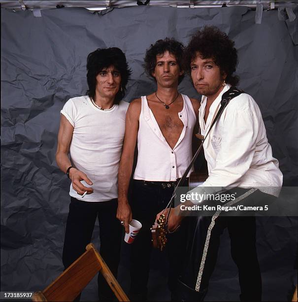 Performers Keith Richards, Ron Wood and Bob Dylan are photographed backstage at Live Aid on July 13, 1985 at JFK Stadium in Philadelphia,...