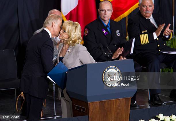 Vice President Joe Biden is greeted by Ariaona Governor Jan Brewer during a memorial service honoring 19 fallen firefighters at Tim's Toyota Center...