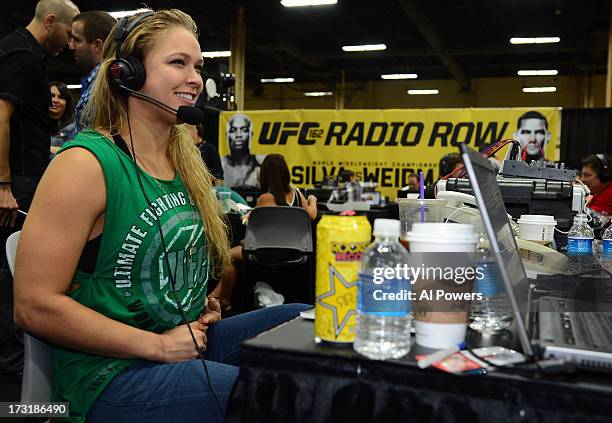 Women's bantamweight champion Ronda Rousey is interviewed during day one of the UFC Fan Expo Las Vegas 2013 at the Mandalay Bay Convention Center on...