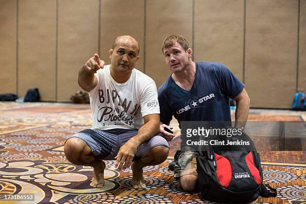 Former UFC champions B.J. Penn and Matt Hughes teach a seminar for fans during day one of the UFC Fan Expo Las Vegas 2013 at the Mandalay Bay...