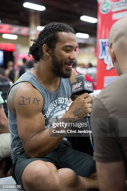 Lightweight champion Benson Henderson is interviewed during day one of the UFC Fan Expo Las Vegas 2013 at the Mandalay Bay Convention Center on July...