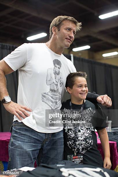 Light heavyweight Stephan Bonnar poses for a photo with a fan during day one of the UFC Fan Expo Las Vegas 2013 at the Mandalay Bay Convention Center...