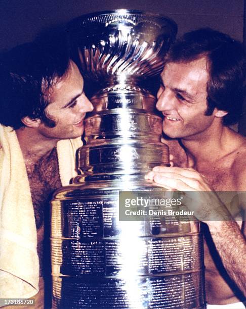 Steve Shutt and Guy Lafleur of the Montreal Canadiens pose with the Stanley Cup circa 1970 in Montreal, Quebec, Canada.