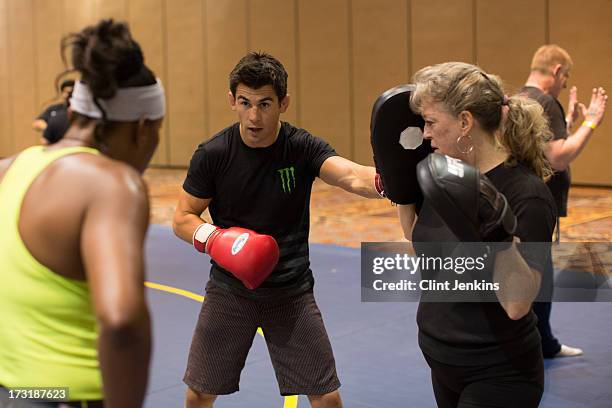 Bantamweight champion Dominick Cruz teaches a seminar during day one of the UFC Fan Expo Las Vegas 2013 at the Mandalay Bay Convention Center on July...