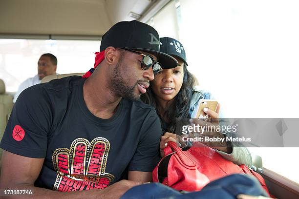 Dwyane Wade and Gabrielle Union arrive at Shanghai Airport to contuine Li-Ning " Way of Wade" China tour on July 8, 2013 in Shanghai, China.